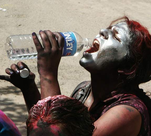 Girls drinking Water During Holi