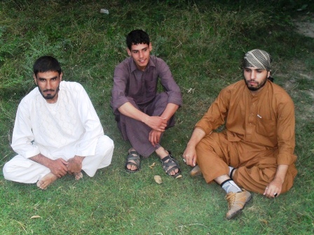 Ahmad Mujtaba sitting with friends